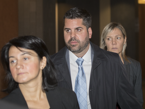 Witness Hugo Tremblay, centre, former aide of former Montreal Mayor Michael Applebaum, during a break in Applebaum's trial on corruption charges at the Montreal Courthouse on Tuesday, November 15, 2016.