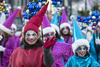 A performer waves during the annual Santa Claus Parade on Ste-Catherine street in downtown Montreal on Saturday, November 19, 2016.