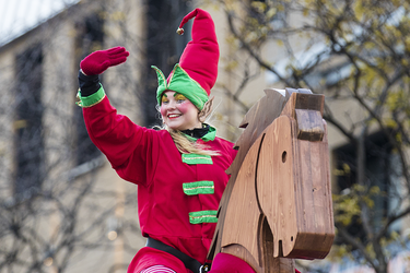 A performer waves during the annual Santa Claus Parade on Ste-Catherine street in downtown Montreal on Saturday, November 19, 2016.