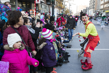 A performer greets the crowd during the annual Santa Claus Parade on Ste-Catherine street in downtown Montreal on Saturday, November 19, 2016.