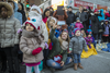 Isabelle Van Schelven, centre,  and her two year-old daughter Philia watch the annual Santa Claus Parade on Ste-Catherine street in downtown Montreal on Saturday, November 19, 2016.