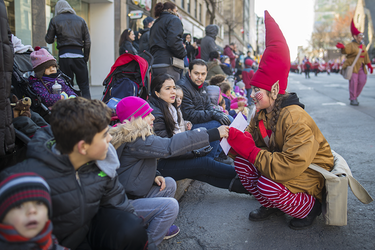 Nine year-old Léa Bacheco hands over her letter to Santa during the annual Santa Claus Parade on Ste-Catherine street in downtown Montreal on Saturday, November 19, 2016.