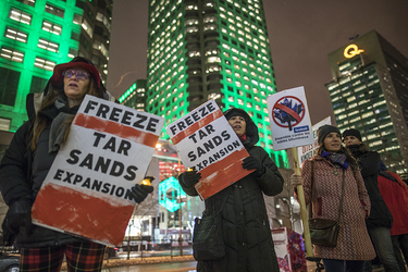 Demonstrators take part in a vigil against the British Columbia Kinder Morgan pipeline expansion in Montreal on Monday, November 21, 2016. The $6.8-billion Kinder Morgan's Trans Mountain pipeline expansion project would ship oil from Alberta’s oil sands to British Columbia through Vancouver’s harbour.