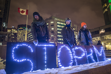 Demonstrators take part in a vigil against the British Columbia Kinder Morgan pipeline expansion in Montreal on Monday, November 21, 2016. The $6.8-billion Kinder Morgan's Trans Mountain pipeline expansion project would ship oil from Alberta’s oil sands to British Columbia through Vancouver’s harbour.