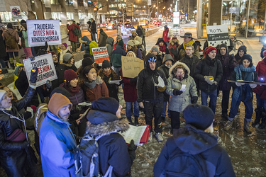 Demonstrators take part in a vigil against the British Columbia Kinder Morgan pipeline expansion in Montreal on Monday, November 21, 2016. The $6.8-billion Kinder Morgan's Trans Mountain pipeline expansion project would ship oil from Alberta’s oil sands to British Columbia through Vancouver’s harbour.