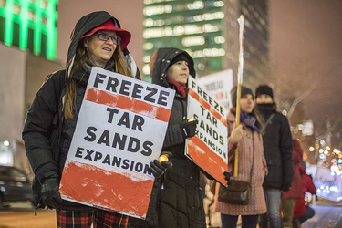 Demonstrators take part in a vigil against the British Columbia Kinder Morgan pipeline expansion in Montreal on Monday, November 21, 2016. The $6.8-billion Kinder Morgan's Trans Mountain pipeline expansion project would ship oil from Alberta’s oil sands to British Columbia through Vancouver’s harbour.
