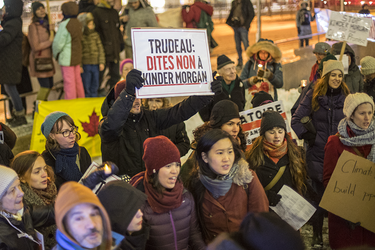 Demonstrators take part in a vigil against the British Columbia Kinder Morgan pipeline expansion in Montreal on Monday, November 21, 2016. The $6.8-billion Kinder Morgan's Trans Mountain pipeline expansion project would ship oil from Alberta’s oil sands to British Columbia through Vancouver’s harbour.