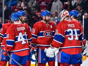 The Montreal Canadiens celebrate their victory over the Detroit Red Wings during the NHL game at the Bell Centre on November 12, 2016 in Montreal, Quebec, Canada.  The Montreal Canadiens defeated the Detroit Red Wings 5-0.