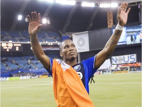 Montreal Impact forward Didier Drogba salutes the crowd after the final game at Olympic Stadium after defeating the Toronto FC 3-2 in the MLS first leg of the Eastern Conference finals action Tuesday, November 22, 2016 in Montreal.