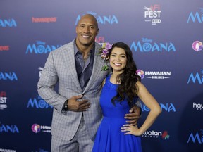 Moana voice actors Dwayne Johnson and Auli'i Cravalho arrive at the Disney film's world première in Los Angeles on Nov. 14, 2016.