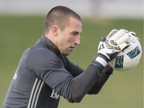 Montreal Impact goalkeeper Evan Bush stops the ball during a practice, Tuesday, November 15, 2016 in Montreal. The Impact will face Toronto FC in the MLS Eastern Conference Final.