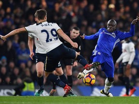 Tottenham Hotspur's English midfielder Harry Winks, left, vies with Chelsea's French midfielder N'Golo Kante during the English Premier League football match between Chelsea and Tottenham Hotspur at Stamford Bridge in London on Nov. 26, 2016.