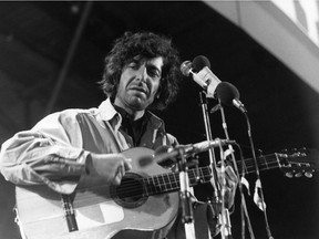 Leonard Cohen performs on stage at the Isle of Wight Festival on Aug. 30, 1970.