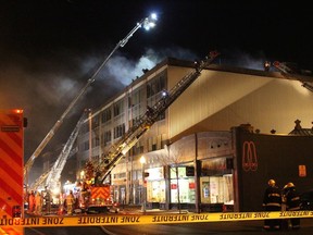 Firefighters battle a blaze in Westmount on Sunday, Nov. 13, 2016.