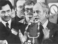René Lévesque takes to the microphone after the Parti Québécois victory in the 1976 election. At left is Camille Laurin, the father of Bill 101.