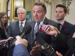 Coalition Avenir Québec Leader François Legault responds to reporters before entering a caucus meeting at the National Assembly on Thursday, Nov. 16, 2016.