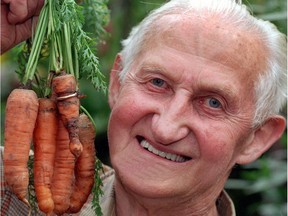 Otto Theer, 81, from Pouch (near Bitterfeld) happily presents a bundle of carrots from his garden. He discovered that one of the carrots was growing through his wedding ring, which he lost six years ago while gardening.