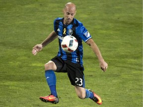 Montreal Impact defender Laurent Ciman chests the ball as they face the Orlando City FC during second half MLS action Wednesday, September 7, 2016 in Montreal.
