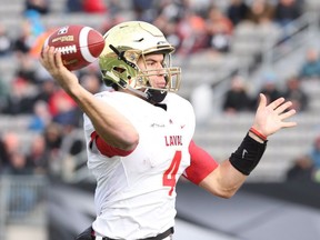 Laval Rouge et Or quarterback Hugo Richard throws during first half U Sports Vanier Cup championship football action against the Calgary Dinos in Hamilton, Ont., on Saturday, Nov. 25, 2016.