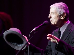 Leonard Cohen acknowledges a standing ovation before opening his set with "Dance Me to the End of Love" Monday June 23, 2008 at Place des Arts in Montreal. (THE GAZETTE/Marcos Townsend)