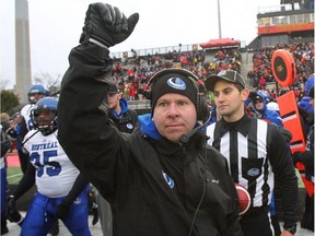 Montreal Carabins' head coach Danny Maciocia raises his arm in celebration of their 25-10 win over the Guelph Gryphons in the CIS Mitchell Bowl football championship game in Guelph, Ont., on Saturday, November 21, 2015.