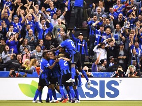 Montreal Impact players celebrate Matteo Mancosu's goal against Toronto FC during first half action in the first leg of the MLS Eastern Conference final at the Olympic Stadium in Montreal, Tuesday, November 22, 2016.