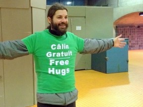 Tommy Boucher in his "free hugs" T-Shirt in the Montreal métro. "I know these guys have the mission to keep the peace in the subway," he said. " But when they give a ticket to those who actually are in peace, where is the world going?"