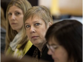 Suanne Stein Day, chair of the Lester-B Pearson School Board, centre, listens during a press conference in Montreal on Thursday April 7, 2016.