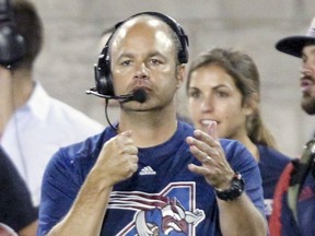 Montreal Alouettes defensive coordinator and assistant head coach Noel Thorpe signals a formation during Canadian Football League game against the Hamilton Tiger-Cats in Montreal Friday July 15, 2016.