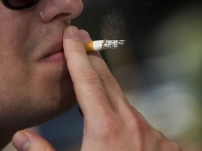 A smoker takes a puff from a cigarette in Montreal.