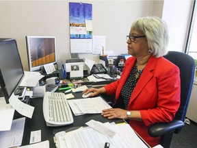 Jennifer Jones at work at KBHNS accountants in Montreal Thursday May 7, 2015. Thanks to the drug Perjeta, Jones is in remission after battling stage 4 breast cancer for two years. When she turns 65 on Friday her private insurance ends and Quebec doesn't cover the cost of this drug yet.