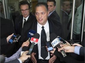 Montreal police chief Philippe Pichet, centre, talks to reporters after is appearance behind a closed door meeting at the city's public-security commission on Tuesday November 1, 2016.