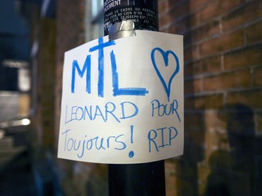 A handmade sign taped to a pole outside Leonard Cohen's home in Montreal following his death Thursday November 10, 2016.