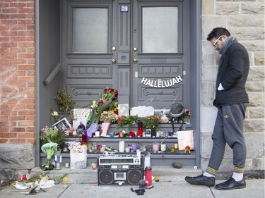Daniel Aragao Cavalcanti, a fan of Leonard Cohen keeps vigil at a makeshift memorial outside the late singer/songwriter's house on Vallières in Montreal, Friday November 11, 2016.  Cohen died in 82 overnight on Thursday the 10th.