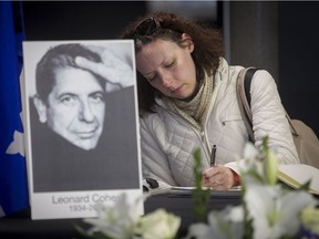 Rosalie Plouffe signs a book of condolences for Leonard Cohen at the Grande Bibliothèque in Montreal on Saturday November 12, 2016. Cohen, born in Westmount in 1934, died at his Los Angeles home on Monday at the age of 82.