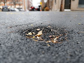 Irregularities appear freshly repaired pavement at the corner of Fairmount Ave. E. and de Gaspé Ave. in the Plateau. It is one spot that Projet Montréal has pointed to as evidence of poor pavement work being done by the city in recent weeks.