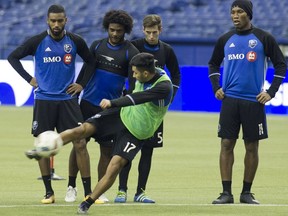 Impact David Choinière, 17, practises his kick in front of teammates, including Didier Drogba, right, during practice on Thursday, Nov. 17, 2016. The Impact play against the Toronto FC on Tuesday,  Nov. 22, 2016, for the first game of the Eastern Conference Championship.