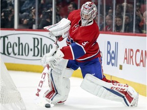 Montreal Canadiens' Carey Price shoots the puck down the ice during Vancouver Canucks power play in second period of National Hockey League game in Montreal Wednesday November 2, 2016.