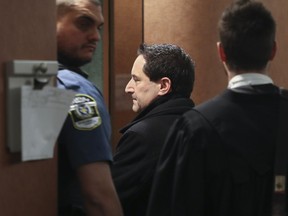Former Montreal mayor Michael Applebaum enters court for the afternoon session of his corruption trial in Montreal on Tuesday, Nov. 22, 2016.