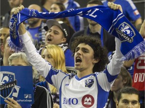 Impact fans cheer prior to Game 1 of the MLS Eastern Conference final held at Olympic Stadium in Montreal on Tuesday November 22, 2016 .