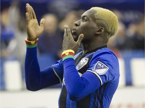 Impact's Ambroise Oyongo blows kisses to the crowd after scoring a goal during second half action in Game 1 of the MLS Eastern Conference final held at Olympic Stadium in Montreal on Tuesday, Nov. 22, 2016, against Toronto FC.