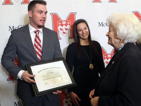 McGill University announced the creation of new McGill athletic financial awards in honour of Jean Béliveau, which recognize outstanding athletes who demonstrate community leadership. Recipient Joel Houle, left received his award from Élise Béliveau, on November 23, 2016. Mélodie Daoust, middle, looks on. She is also an inaugural winner of the Jean Béliveau Awards.