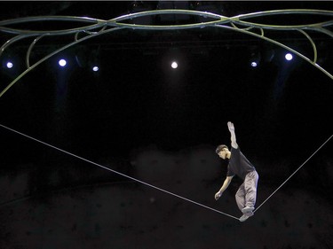 Slackline artist Qiu Jiangming works on his routine during rehearsal of Cirque du Soleil's Ovo at the Bell Centre in Montreal Tuesday, November 29, 2016.