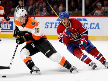 Canadiens centre Andrew Shaw tries break up the play as Philadelphia Flyers defenceman Michael Del Zotto carries the puck during NHL action at the Bell Centre in Montreal on Saturday, Nov. 5, 2016.