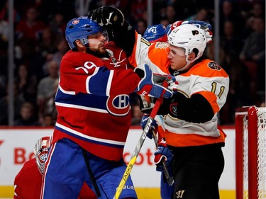 Canadiens defenceman Andrei Markov, left, and Philadelphia Flyers centre Travis Konecny get in a shoving match during NHL action at the Bell Centre in Montreal on Saturday, Nov. 5, 2016.
