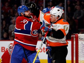 Montreal Canadiens defenceman Andrei Markov, left, and Philadelphia Flyers center Travis Konecny get in a shoving match during NHL action at the Bell Centre in Montreal on Saturday November 5, 2016.