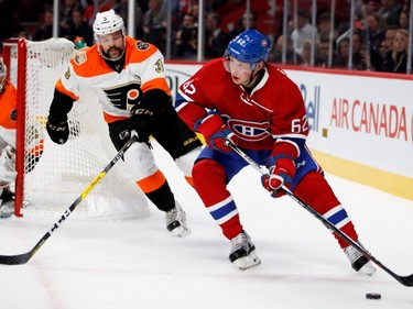 Canadiens' Artturi Lehkonen looks for an open man as Philadelphia Flyers defensceman Radko Gudas tries to block the pass during NHL action at the Bell Centre in Montreal on Saturday, Nov.5, 2016.