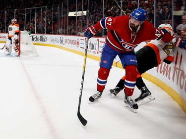 Canadiens' Alexander Radulov checks Philadelphia Flyers defenceman Brandon Manning sending him to the ice during NHL action at the Bell Centre in Montreal on Saturday, Nov. 5, 2016.