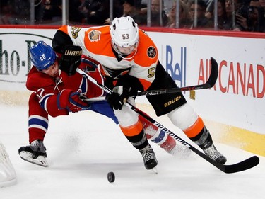 Philadelphia Flyers defenceman Shayne Gostisbehere knocks Montreal Canadiens' Artturi Lehkonen to the ice during NHL action at the Bell Centre in Montreal on Saturday, Nov. 5, 2016.