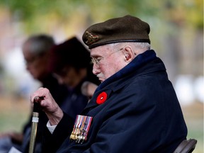 Dave McCrindle pays his respects during the Last Post at a ceremony in N.D.G. Park on Sunday. McCrindle was in the Royal Canadian Artillery from June 1940 until the end of the Second World War, serving in England, Sicily, France and Holland.